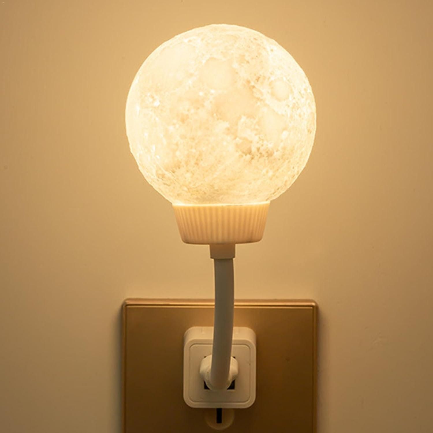 Decorative night light bulb attached to a wall socket with a warm glow on a beige background.