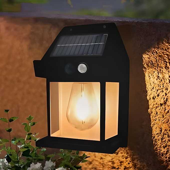 Solar-powered outdoor light fixture on a wall with a warm glow.
